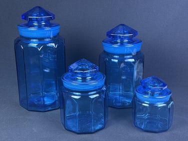 Vintage L.E. Smith Blue Glass Panel Canister Set Four jars with lids.