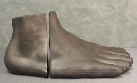Ceramic Foot Shaped Bookends Mercana Brown ceramic foot book ends, one piece are the toes, the other