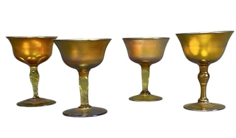 Tiffany Favrile Cordial Glasses Set of Four Four golden iridescent favrile glass stemmed cordials.