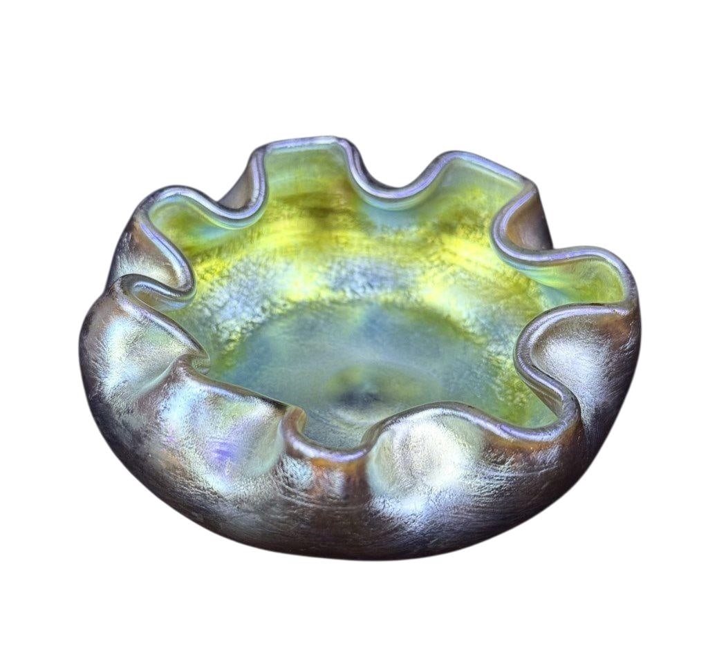L.C. Tiffany Iridescent Glass Salt Cellar 3 x 1.25 inches. Free from damage.: 3 x 1.25 inches. Free from damage. See photos for further item details and condition information. .Favrile Glass This type of iridescent art glass was developed by Louis Comfort Tiffany and his glassm