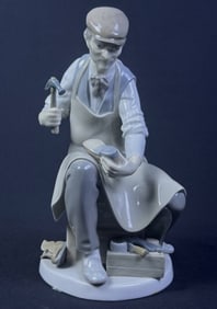 Lladro 4853 The Cobbler Porcelain Figurine 9.5 inches tall by 5.5 inches deep by 5.5 inches wide.