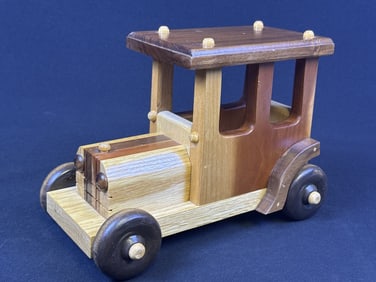 Handcrafted Wooden Car Toy Multi colored wood pieces.   Rolling wheels.   10 x 7 x 4 inches.