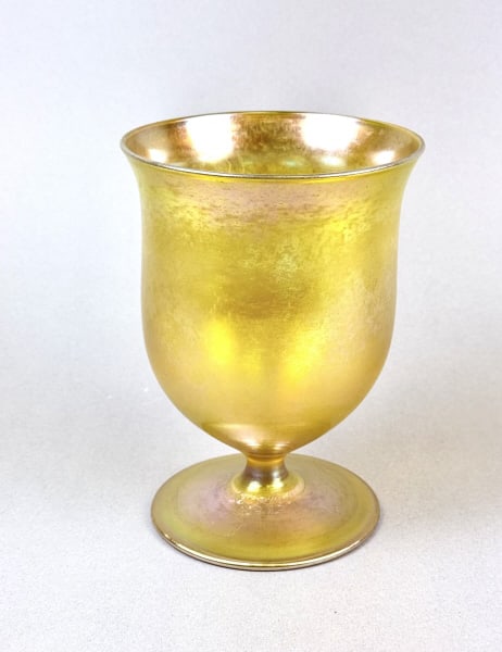 Aurene Iridescent Art Glass Footed Vase Marked Aurene and: Marked Aurene and 3142 Good condition free from chips or cracks. 6 x 4.25 inches.