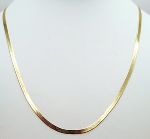 14K Yellow Gold 24" Herringbone Chain Weighs 8.2 grams.