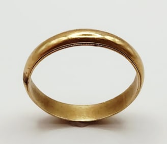 14K Yellow Gold Band Ring Ring is size 13. Weighs 4.7 grams. There is a blemish by the 14K mark.