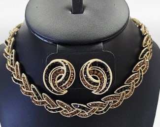 Vintage Signed Crown Trifari Cavalcade Set Necklace measures: Necklace measures 18" Missing one rhinestone by chain. See photo #4 The design is a braided rope-style, with channel set amber and black rhinestones. Goldtone is shiny and bright, and all pieces are s