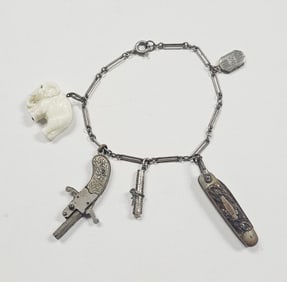 Vintage Pistol, Knife, and Elephant Charm Bracelet Bracelet Measures 7.5" Silver Tone Metal