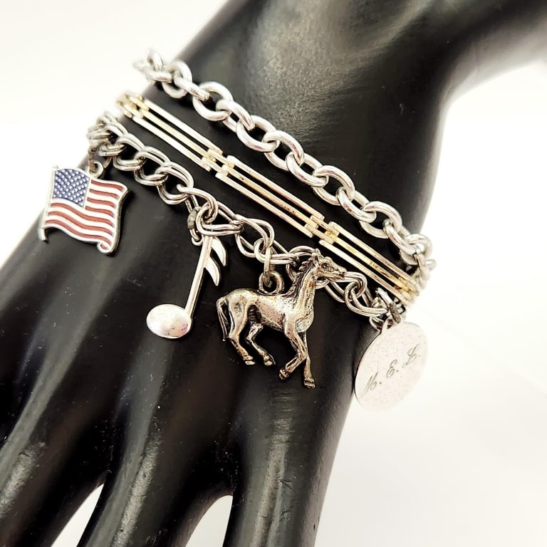 Beau Sterling Charm Sterling Chain & Sterling Link Bracelets: Link Bracelets Only the musical note & flag are sterling. Lot weighs 38.9 gramsFor the best shipping rates, please select "Self-Arranged." Once you've done this, you will automatically be added to Kel