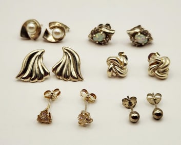925 Sterling Silver Pierced Earrings Including Opal Pearl CZ Etc. Lot weighs 9.8 grams.