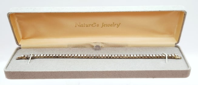 Nature's Jewelry 925 Vermeil CZ Tennis Bracelet Bracelet is 7". Weighs 13 grams.