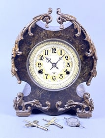 New Haven USA Cast Metal Mantle Clock Includes two keys and pendulum.  Not overwound.