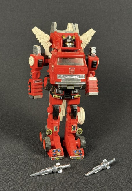 Vintage Transformers G1 Inferno With two rockets and wing pieces. Missing hands and gun. One wheel: With two rockets and wing pieces. Missing hands and gun. One wheel split. Approximately 5.50 x 2 x 2.25 inches when in truck mode.