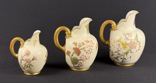 Royal Worcester Blush Ivory Flat Back Pitchers Floral pattern with gold highlights.