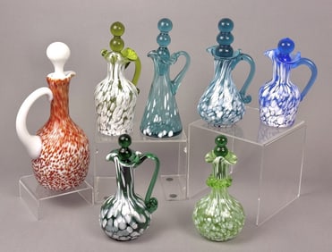 Vintage Glass Cruets Colored Glass w Spatter 7 total standing between 5 and 8.25 inches tall.