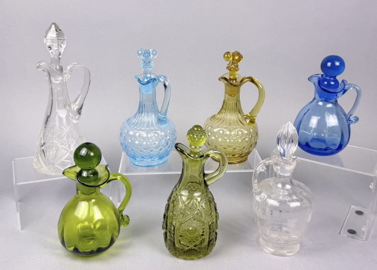 Vintage Glass Cruets Clear & Colored Glass 7 total standing between 5.5 and 8 inches tall.: 7 total standing between 5.5 and 8 inches tall. Free from cracks. See photos for further details.