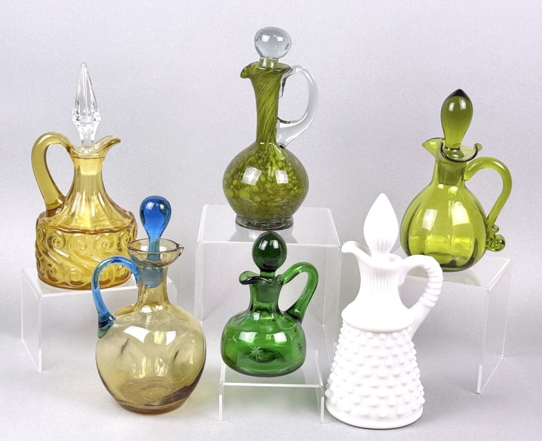 Vintage Colored Glass Cruets 6 total standing between 4.5 and 7.75 inches: 6 total standing between 4.5 and 7.75 inches tall. Free from cracks. See photos for further details.