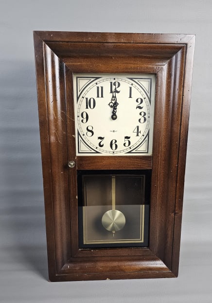 Vintage USA Howard Miller Wall Clock Model NO.: Model NO. 5027 Measures 23.5 inches tall x 13.5 inches wide. Battery operated, untested. Scratches and nicks on wood. Please see images for details regarding the condition.