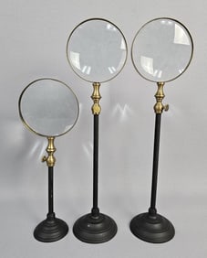 Trio of Anthropologie Magnifying Glasses on Stands Measure 11-15 inches tall. One has small nick in