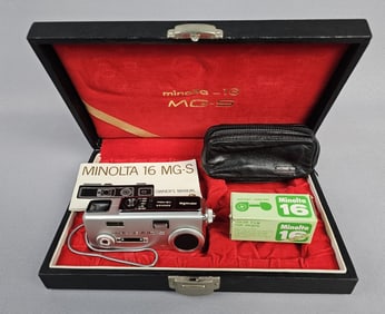 Minolta-16 MG-S Film Camera Kit Housed in its original black textured hard case with a red
