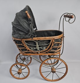 Antique-Style Wicker and Metal Doll's Pram A doll's carriage, featuring a woven rattan basket body
