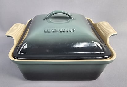 Le Creuset Stoneware Square Casserole Dish Measures 12 x 10 x 6 inches tall. Free from chips or