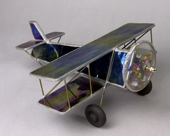 Stained Glass Airplane Kaleidoscope Good condition free from cracks.  Wooden wheels. See photos for