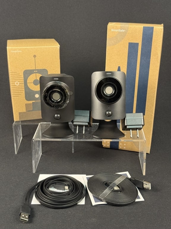 Simplisafe Cameras and Yard Sign Stake Two cameras with usb cords and plugs one in box. (1 of 5)