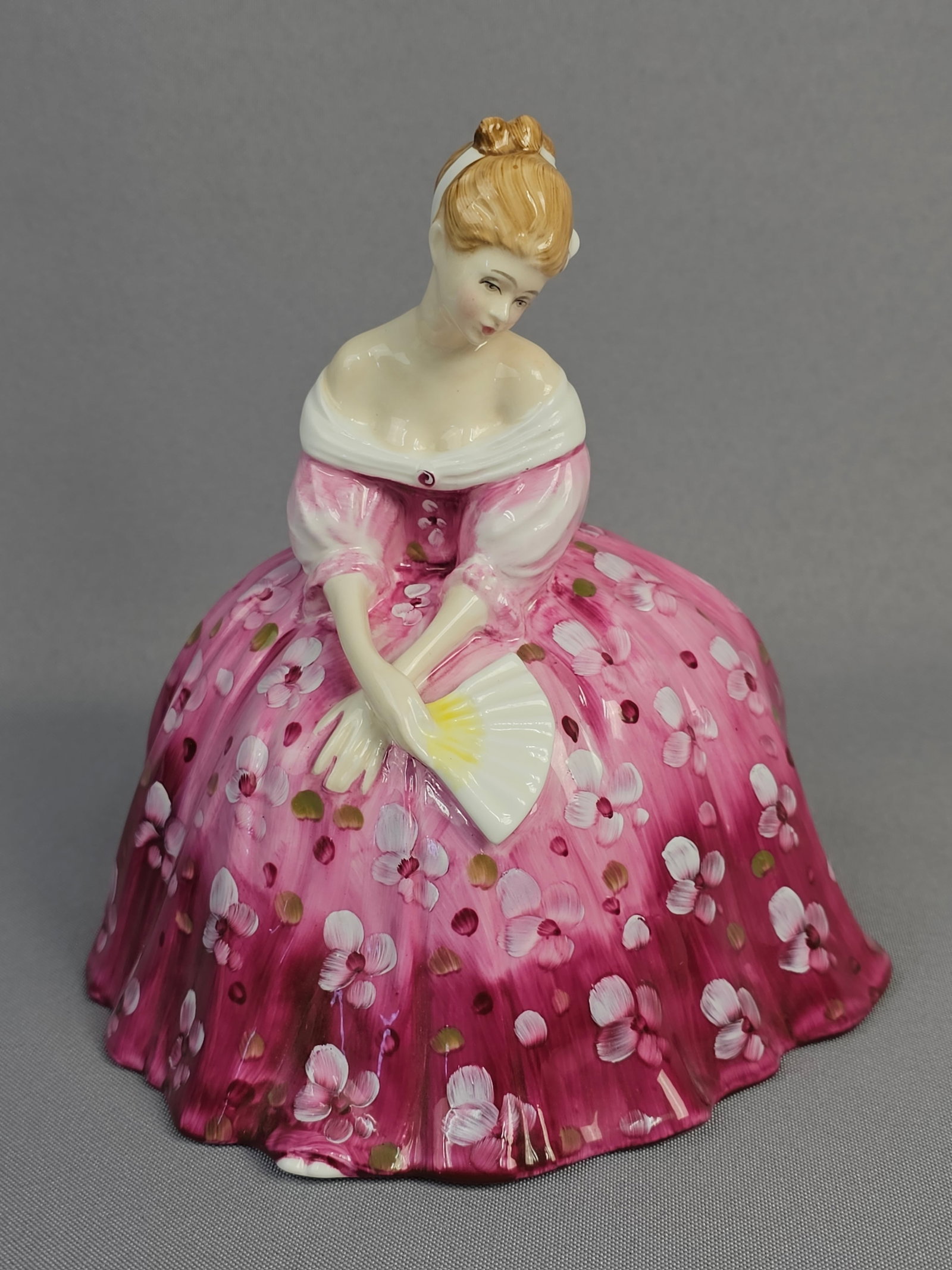 Royal Doulton Bone China Figurine 'Victoria' HN 2471, Modeled by Peggy Davies, Dated 1972: A Royal Doulton bone china figurine, 'Victoria, ' model number HN 2471, modeled by Peggy Davies. This elegantly posed female figure is depicted in a romantic, historical style, wearing a voluminous pi