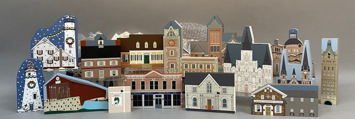 A Collection of Approximately 28 The Cat's Meow Village Hand-Painted Wooden Architectural Miniatures