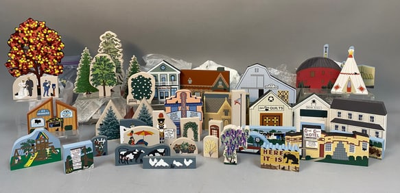 A Collection of The Cat's Meow Village Wooden Cutouts