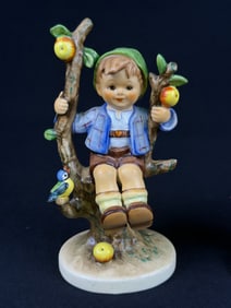 A Pair of Goebel M.I. Hummel 'Apple Tree Boy' and 'Apple Tree Girl' Figurines
