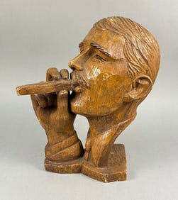 A 20th Century Composite Bust of a Man with Cigar, simulating carved wood