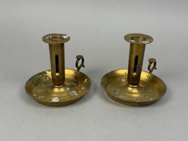 A Pair of Brass Push-Up Chambersticks