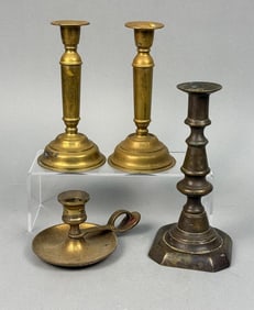 A Collection of Assorted Brass Candlesticks
