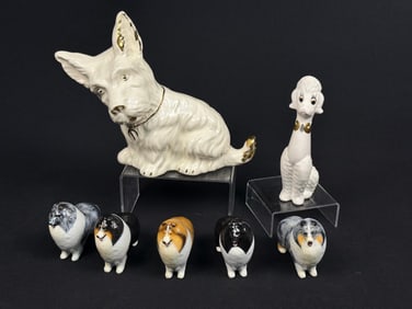 A Group of Seven Ceramic Dog Figurines, including a Vintage Scottish Terrier Planter and Five Signed