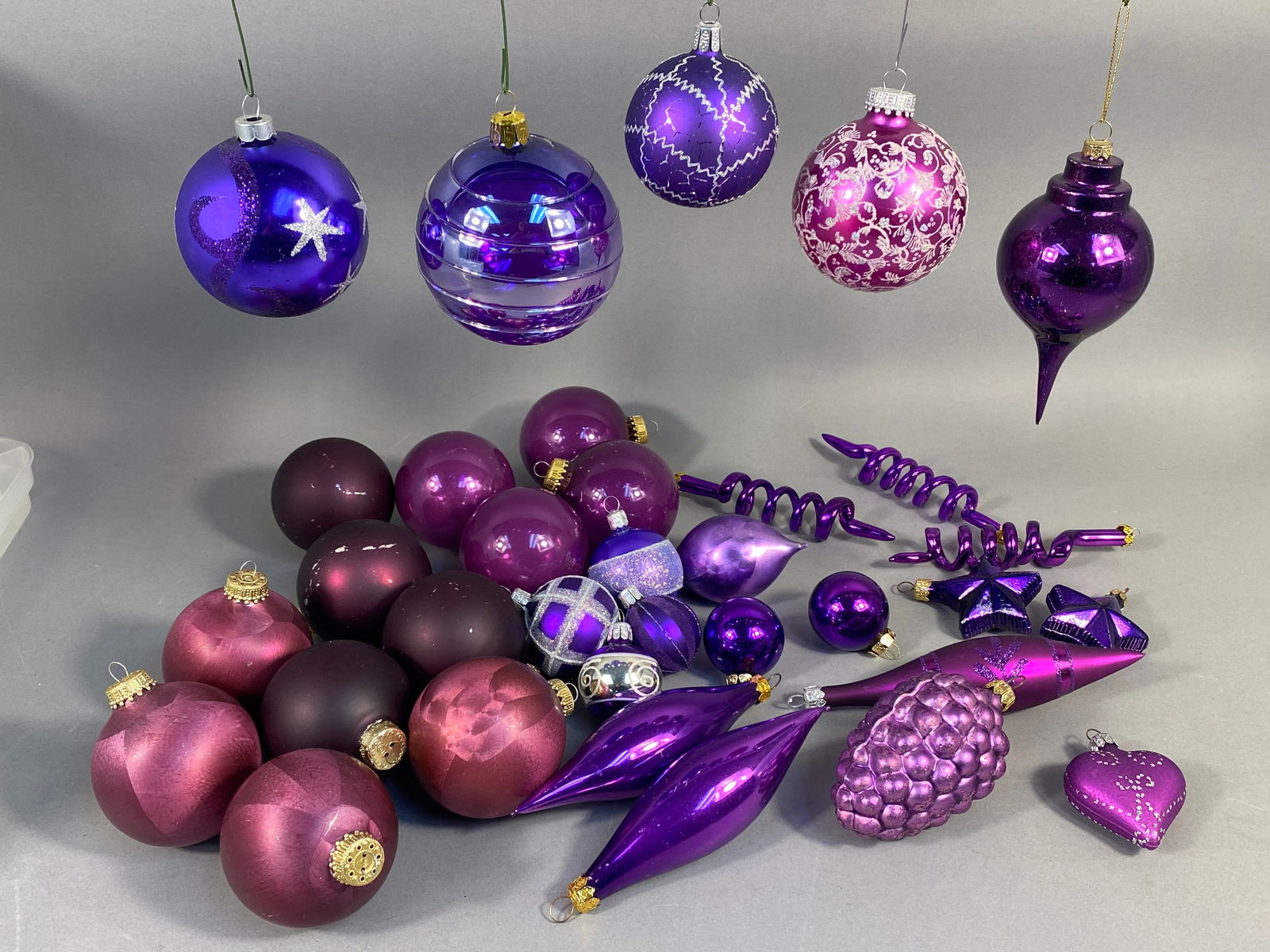 A Collection of Blown Glass Christmas Ornaments, Predominantly Purple and Magenta, with 'WEST (1 of 15)