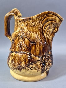 A Bennington Rockingham Dog Handle Hunt Scene Pitcher