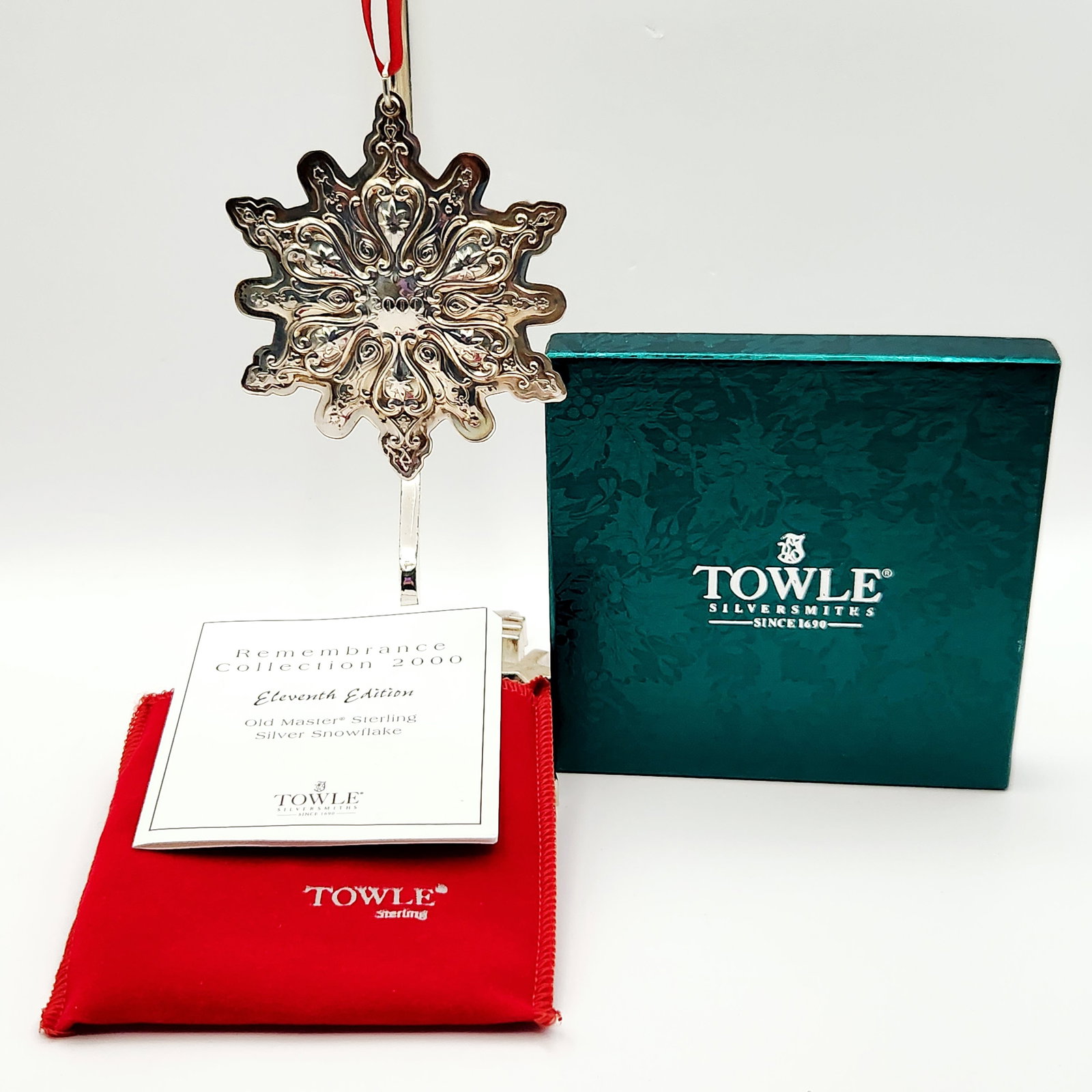 Towle Silversmiths Old Master Sterling Silver Snowflake Ornament 18.9 Grams: A Towle Silversmiths 'Old Master® Sterling Silver Snowflake' Christmas ornament from the 'Remembrance Collection 2000', identified as the Eleventh Edition. The sterling silver ornament is crafted 
