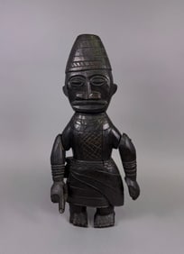 A Yoruba Ibeji Twin Figure, Male, Carved Wood