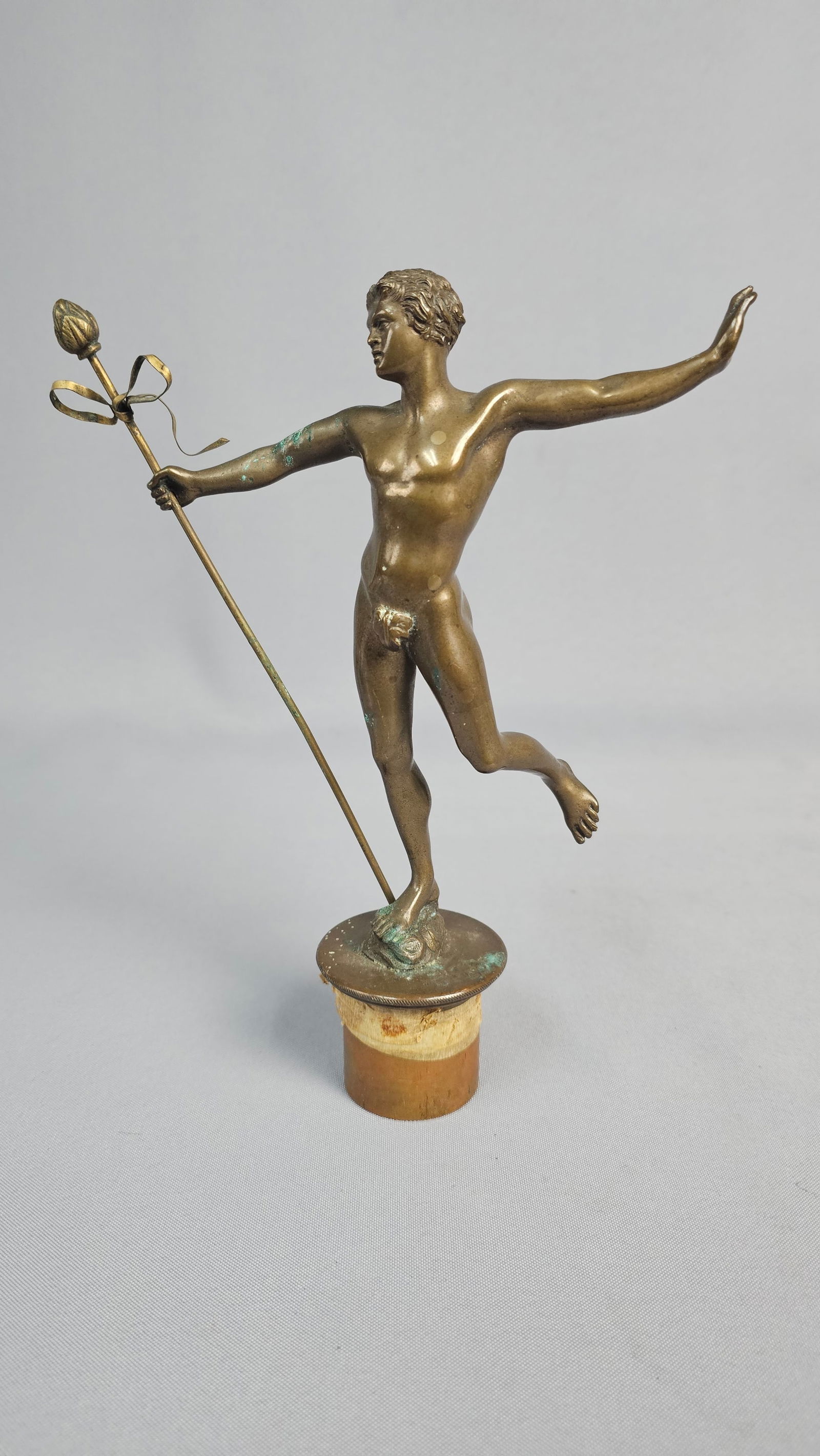 Hippolyte Alexandre Moulin, 'A Find In Pompeii', A Bronze Sculpture: A bronze sculpture by Hippolyte Alexandre Moulin, titled 'A Find In Pompeii'. The piece depicts a youthful nude male figure in a dynamic pose, standing on one leg with arms outstretched. He holds a ta