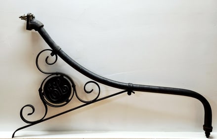 A Wrought Iron Trade Sign Light Bracket with Monogram