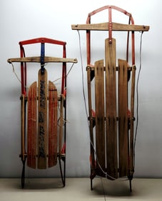 A Pair of Vintage Flexible Flyer and Lightning Type Snow Sleds