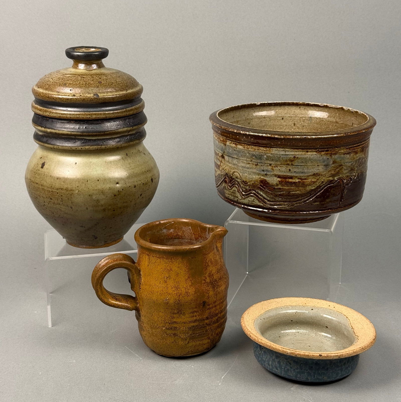 A Group of Studio Stoneware Pottery, comprising a Lidded Jar, Pitcher, Bowl, and Dish (1 of 8)