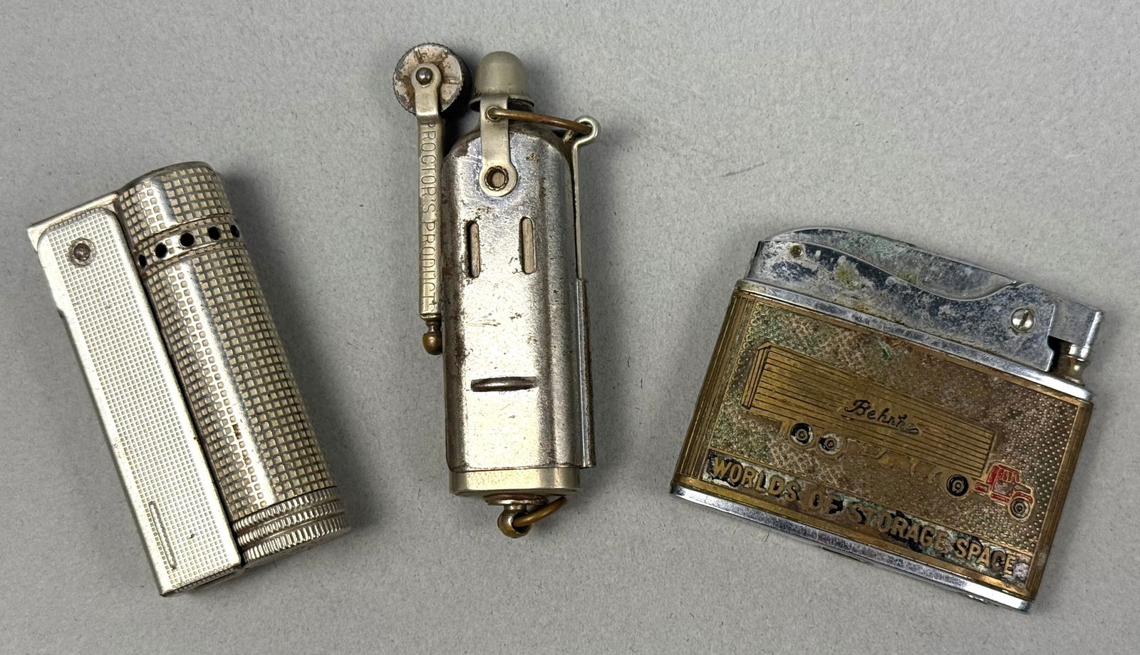 A Group of Three Vintage Lighters, including a Proctor's Products Trench Lighter (1 of 8)