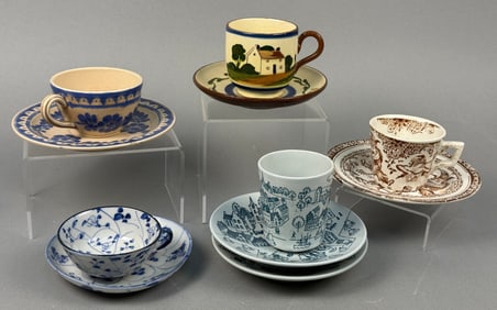 A Collection of Five Ceramic Cup and Saucer Sets, including a Nymolle Art Faience Hoyrup Demitasse