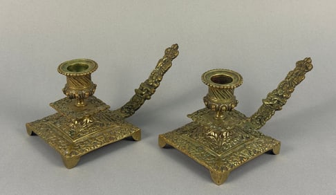 A Pair of French Revival Brass Figural Chambersticks