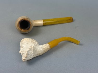 A Pair of Meerschaum Pipes, one carved as a Sultan Head