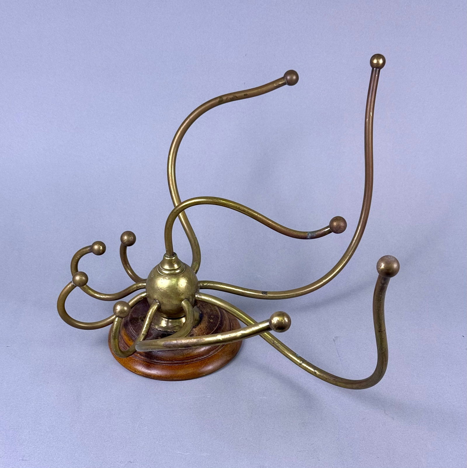 An Early 20th Century Brass and Wood Eight-Arm Wall-Mounted Rack (1 of 10)