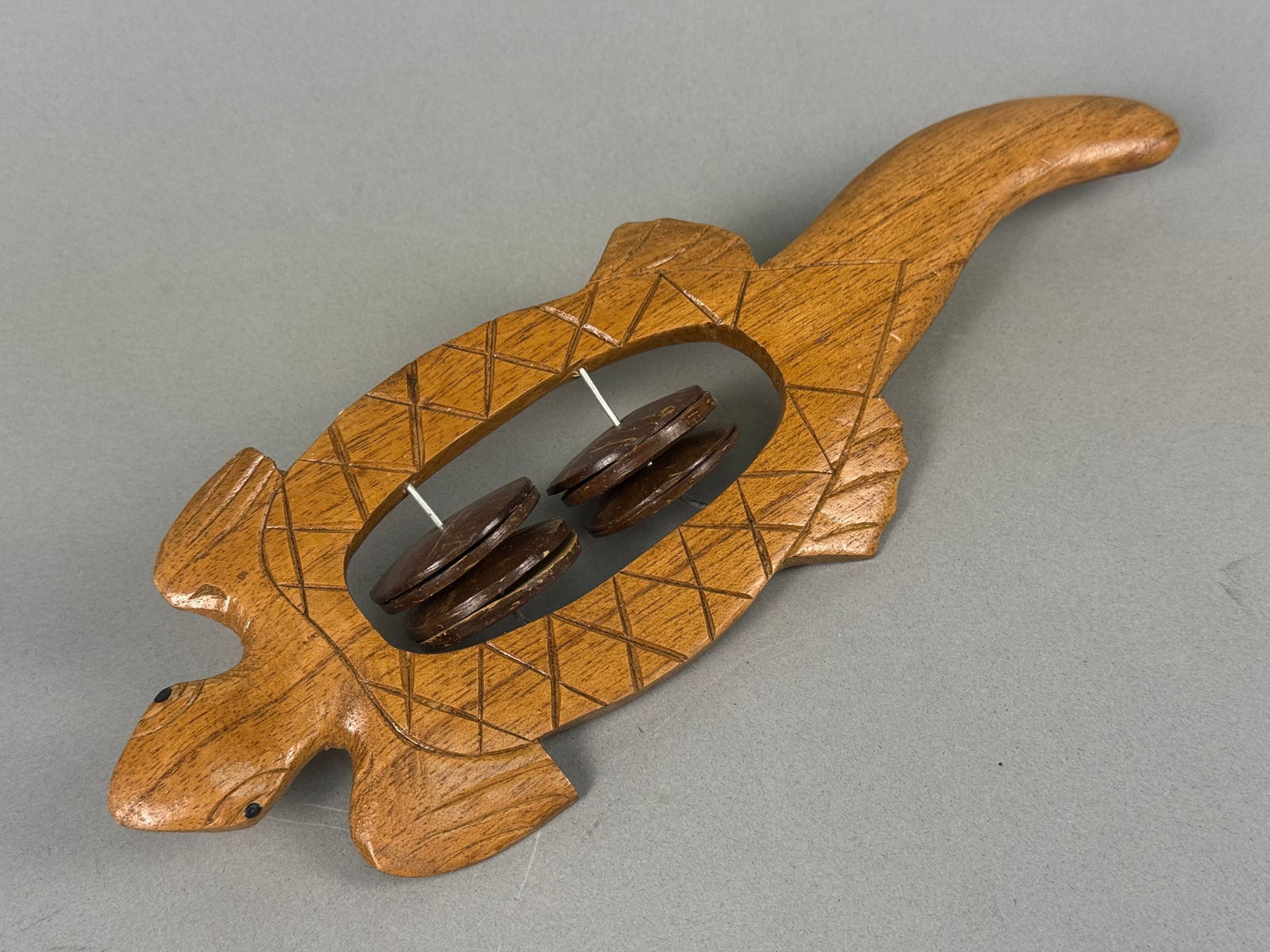 A Carved Wooden Turtle-Theme Maraca with Coconut Shell Discs (1 of 5)