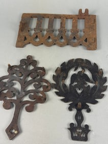 Three Cast Iron Decorative Items, including a Wilton Eagle Heart Trivet
